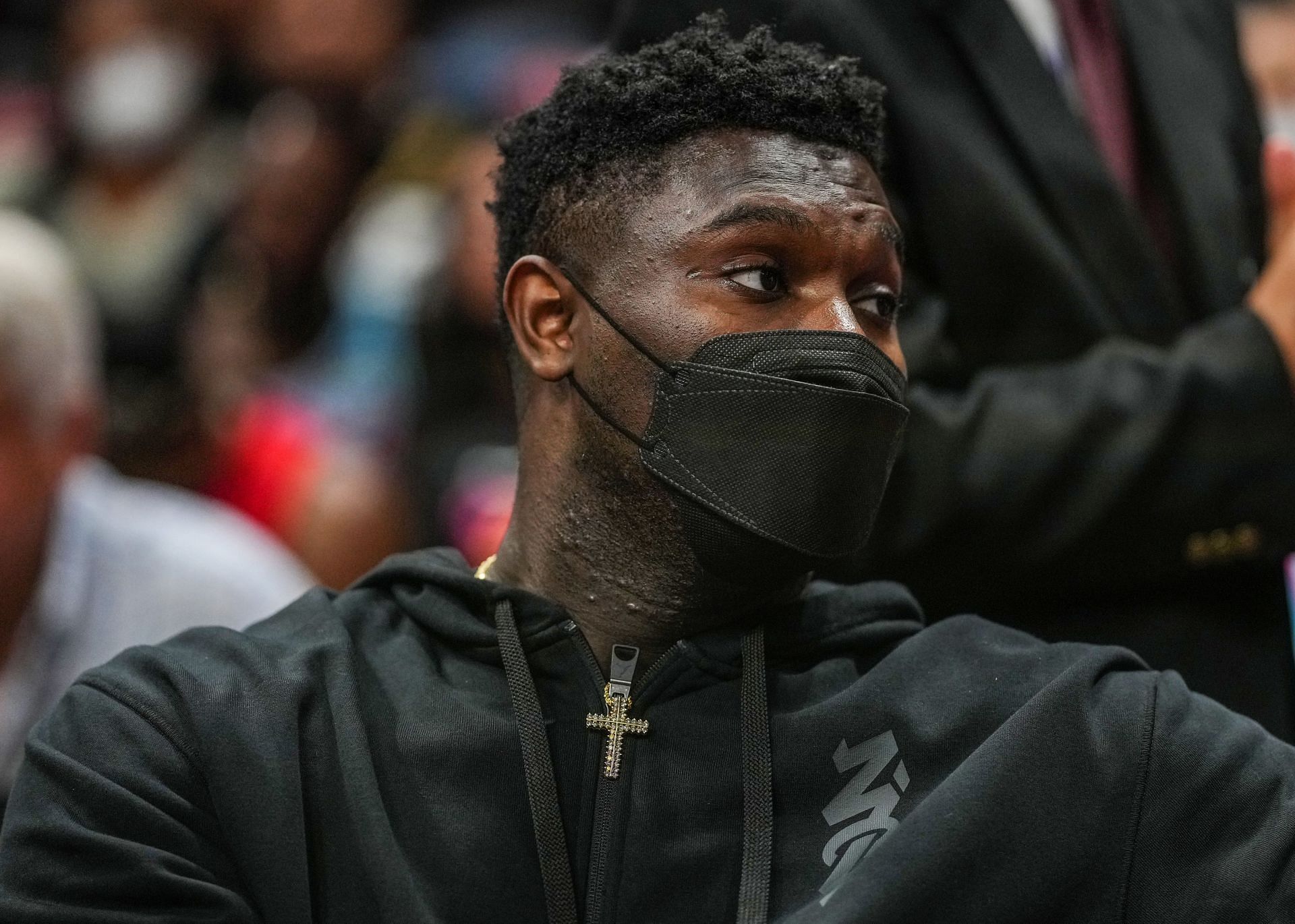 Zion Williamson #1 of the New Orleans Pelicans looks on from the bench during a timeout against the Miami Heat.
