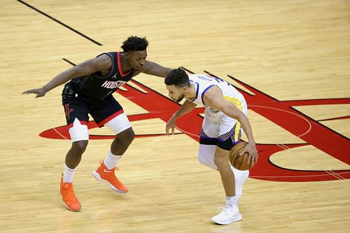 Stephen Curry (right) of the Golden State Warriors against Houston Rockets' Jae'Sean Tate.