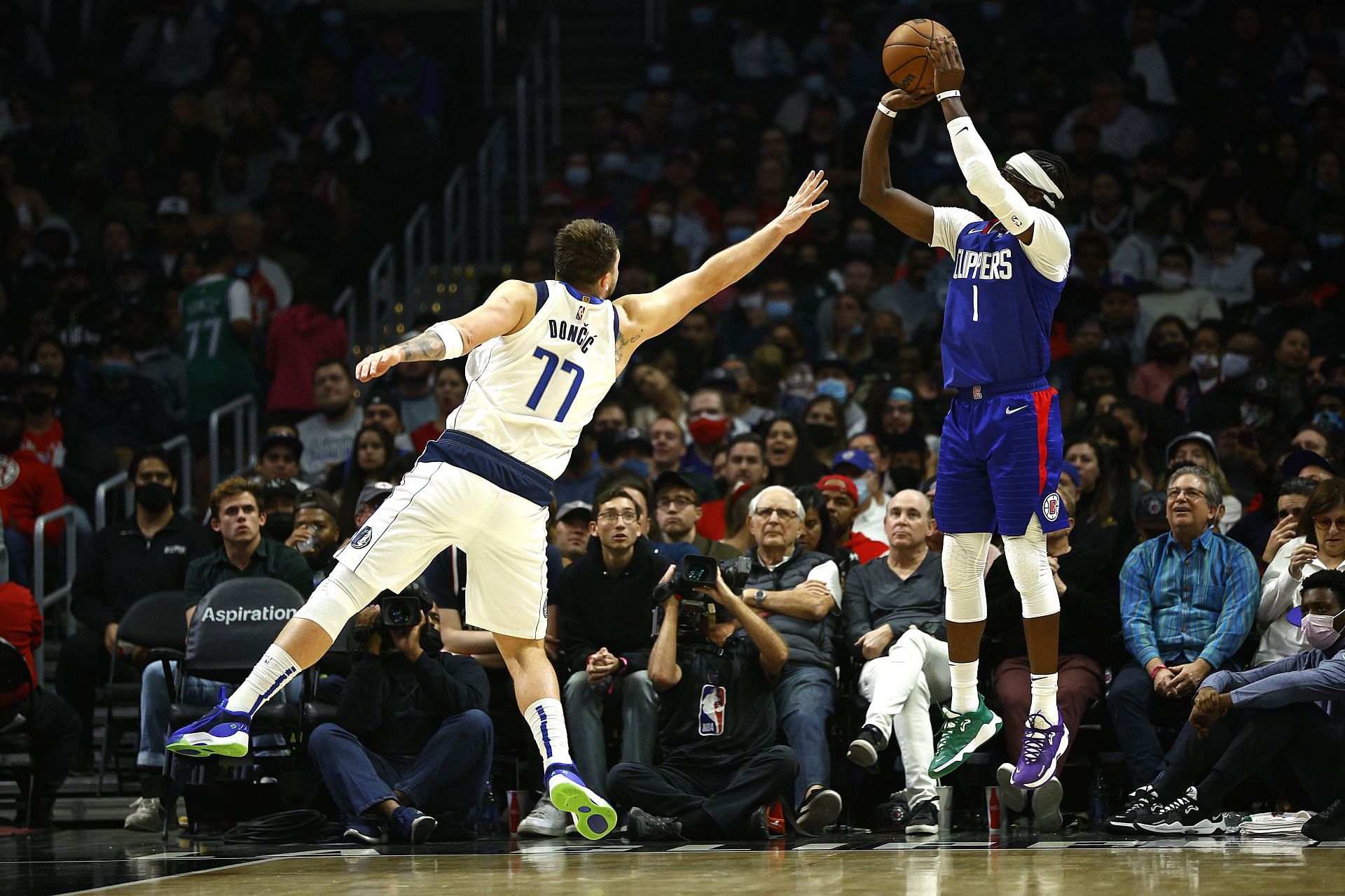 Reggie Jacson shoots over Luka Doncic