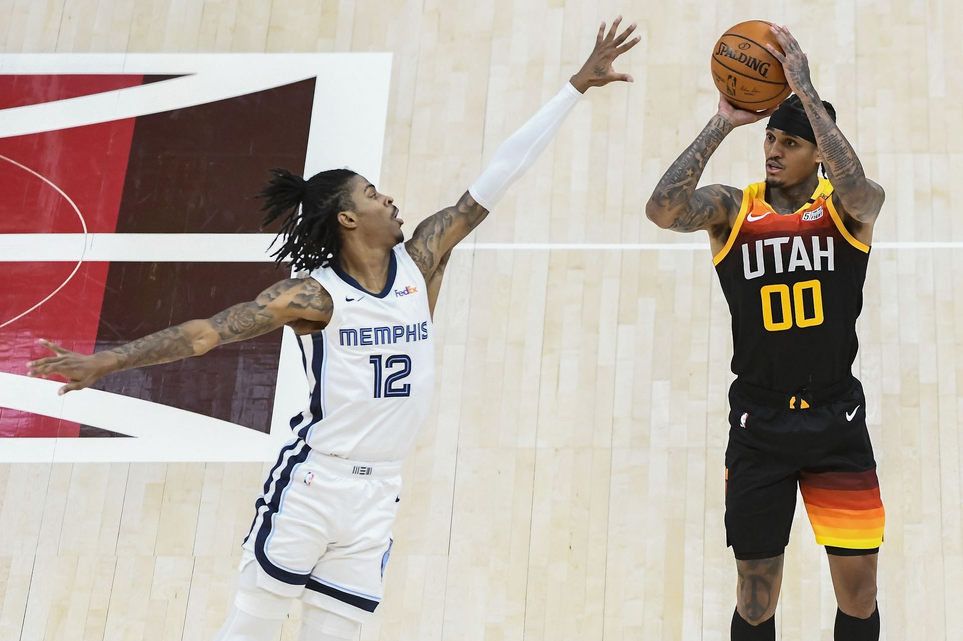 Jordan Clarkson of the Utah Jazz shoots over Ja Morant of the Memphis Grizzlies