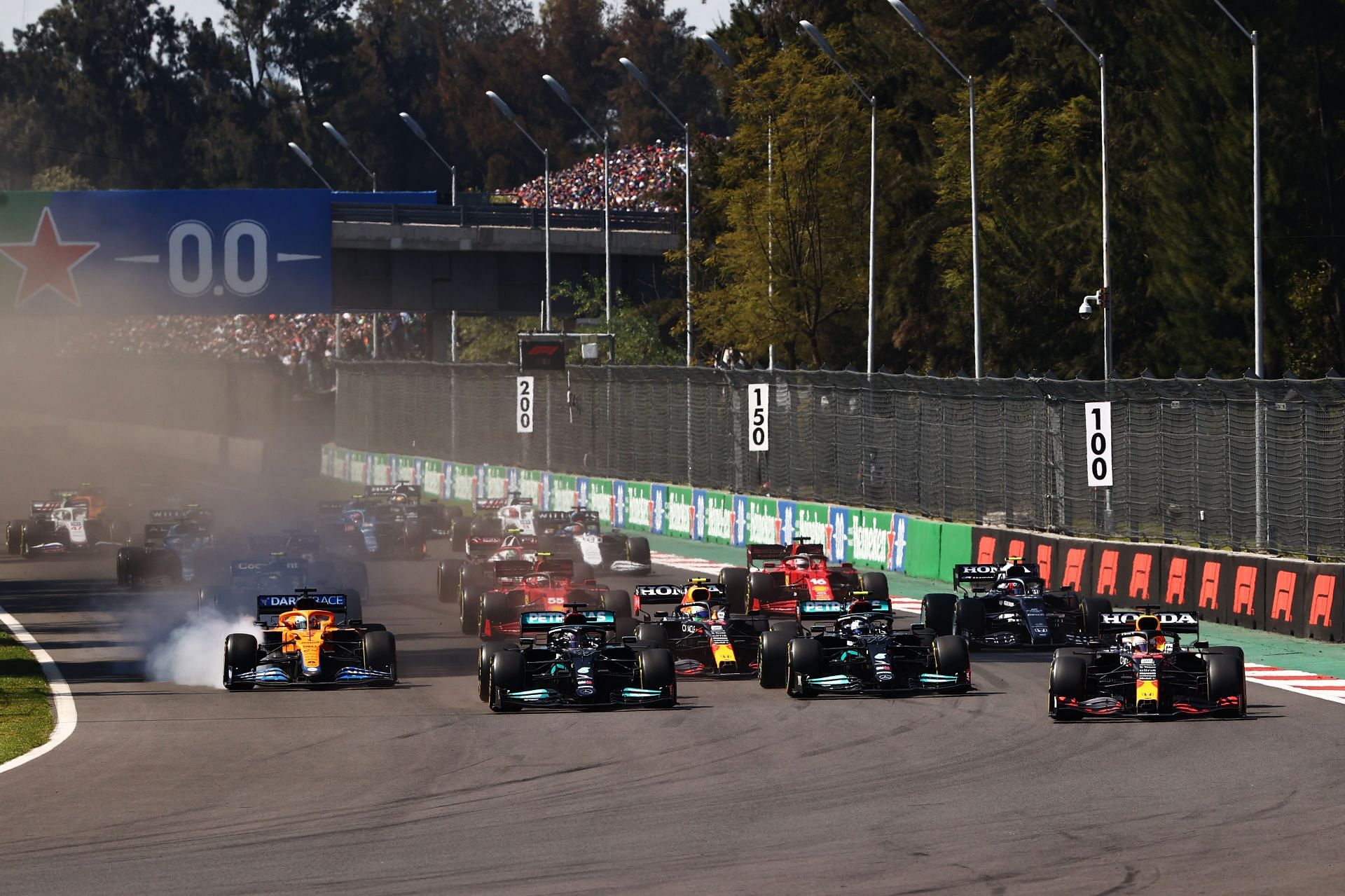 Max Verstappen leads Lewis Hamilton of Great Britain and the rest of the field at the start during the 2021 Mexican GP. (Photo by Mark Thompson/Getty Images)