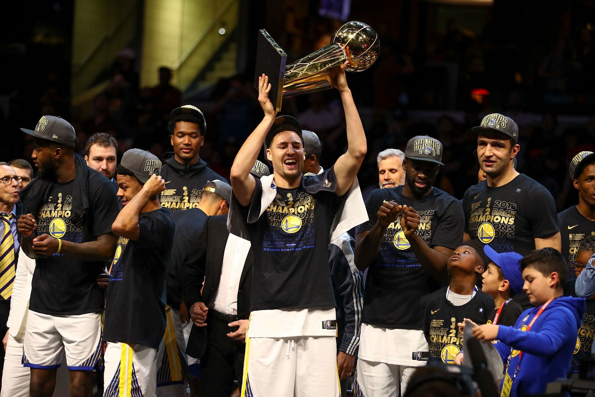 Klay Thompson #11 of the Golden State Warriors celebrates with the Larry O'Brien Trophy