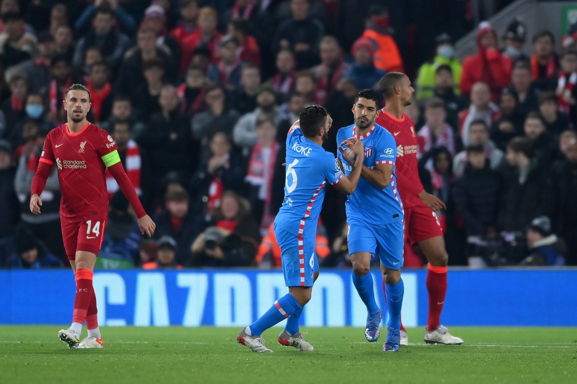 Luis Suarez (R) did not enjoy a happy return to Liverpool