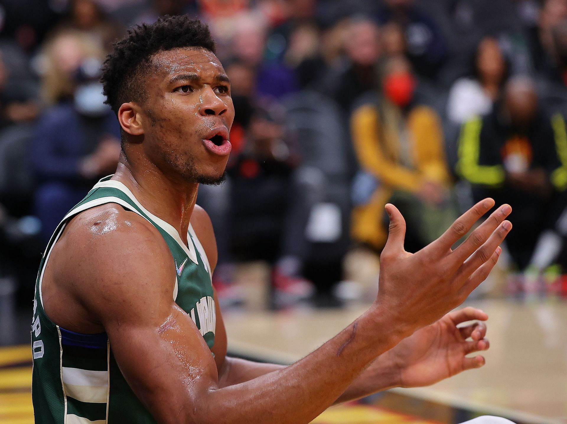 Giannis Antetokounmpo #34 of the Milwaukee Bucks reacts as he is charged with an offensive foul against the Atlanta Hawks during the second half at State Farm Arena on November 14, 2021 in Atlanta, Georgia.