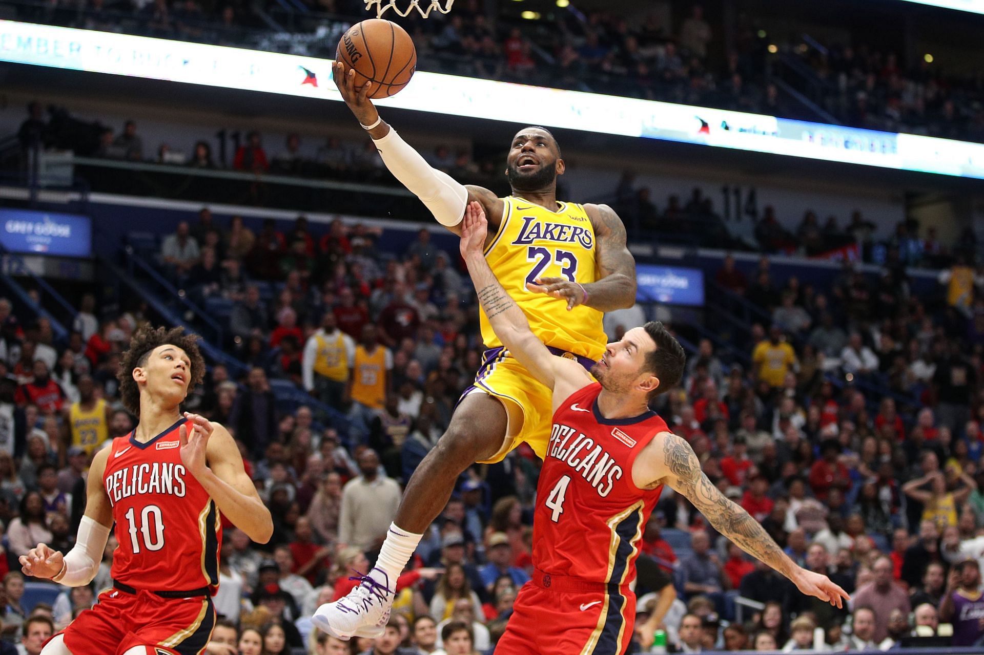 LA Lakers star LeBron James drives against JJ Redick