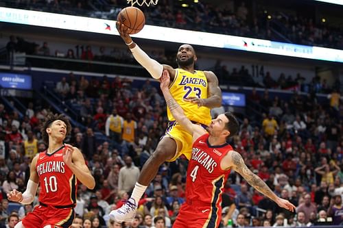 LA Lakers star LeBron James drives against JJ Redick