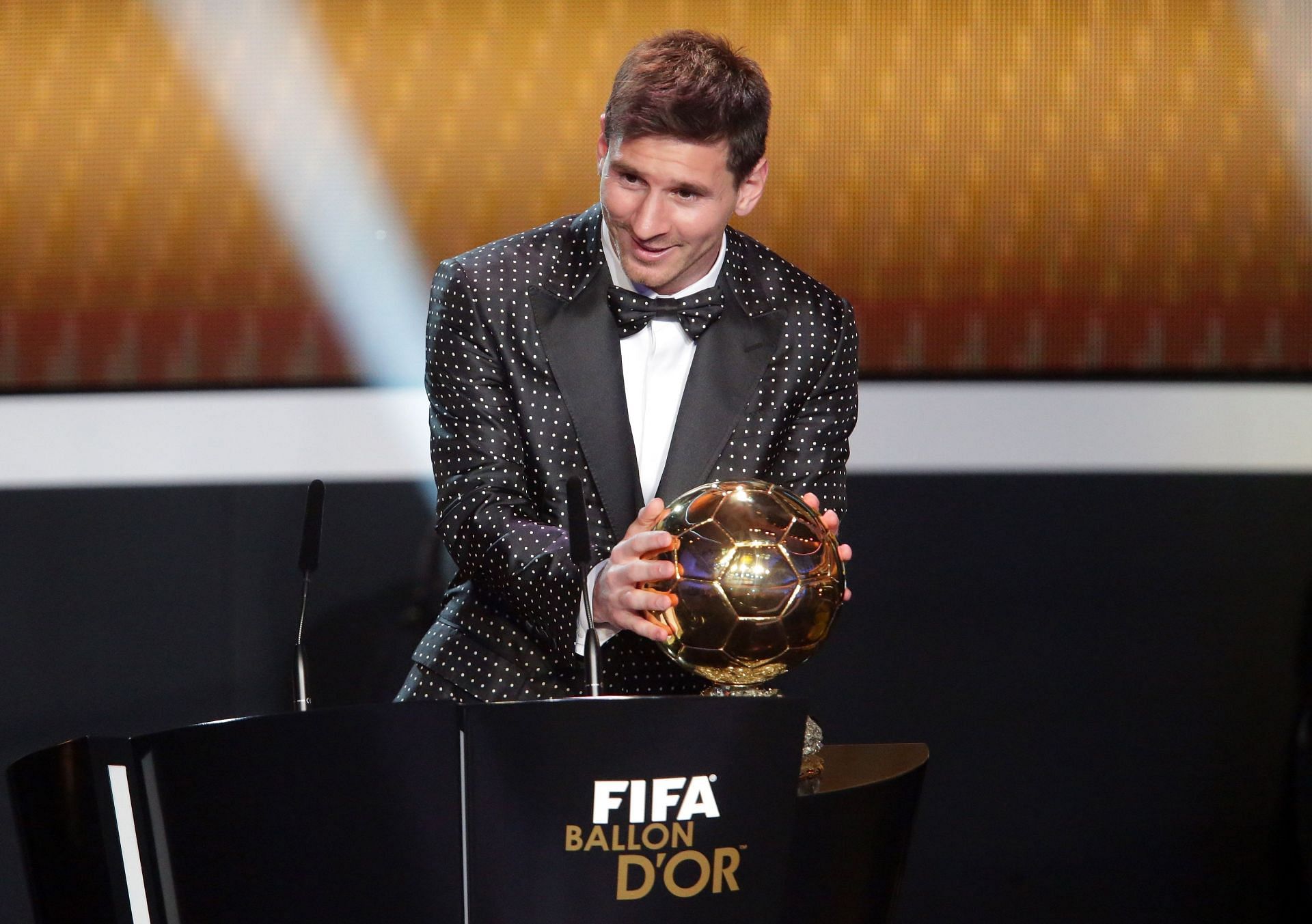 &quot;My precious!!&quot; - Lionel Messi caresses his trophy during the FIFA Ballon d&#039;Or Gala 2012.