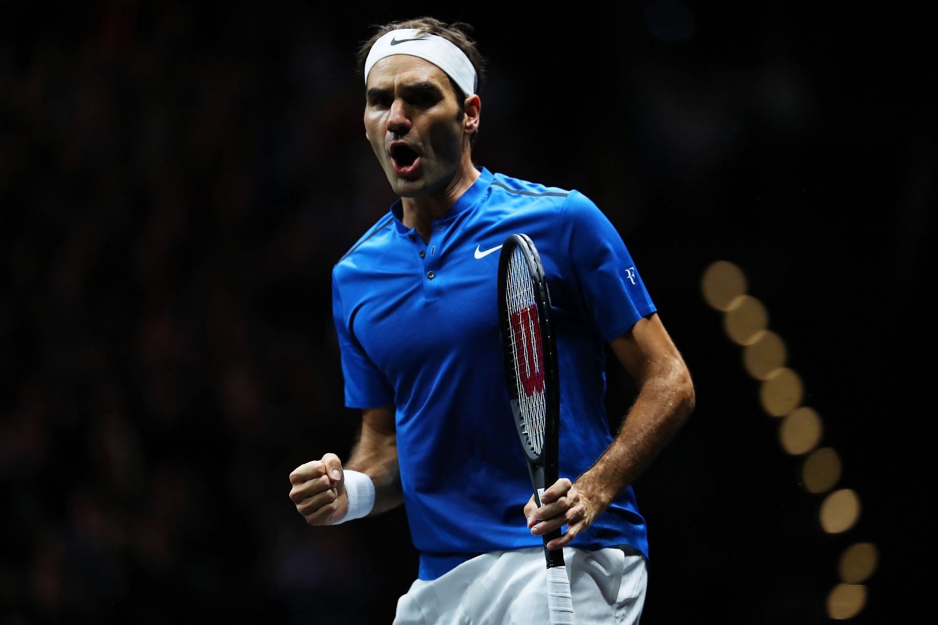 Roger Federer celebrates a point against Nick Kyrgios at the 2017 Laver Cup