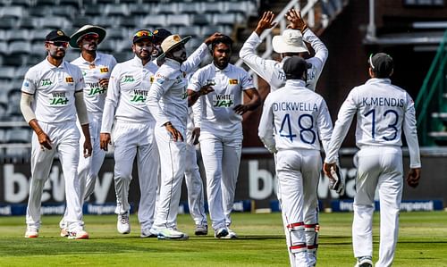 The Sri Lankan cricket team celebrate a wicket.