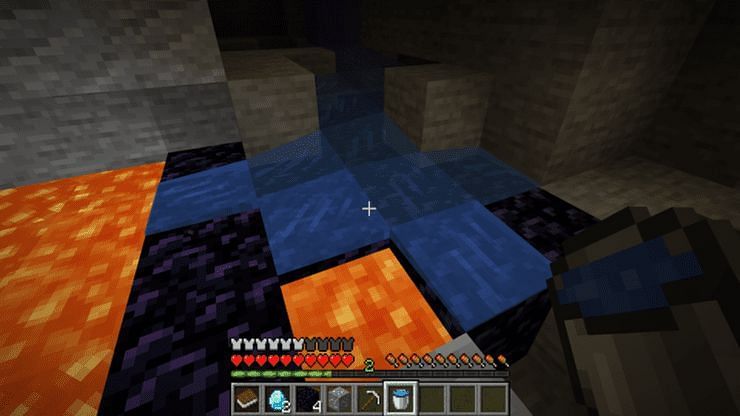 Water bucket in caves (Image via Minecraft)