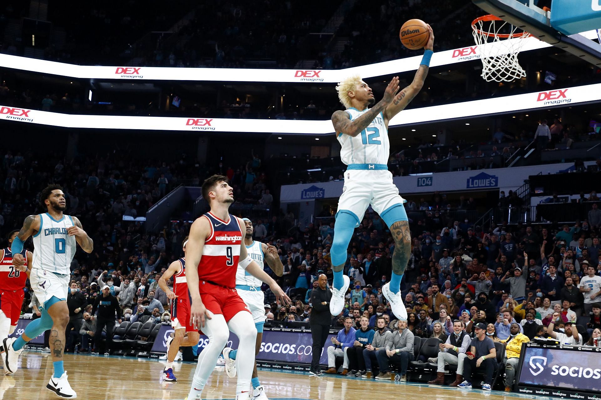 Kelly Oubre Jr. attempts a layup against the Washington Wizards