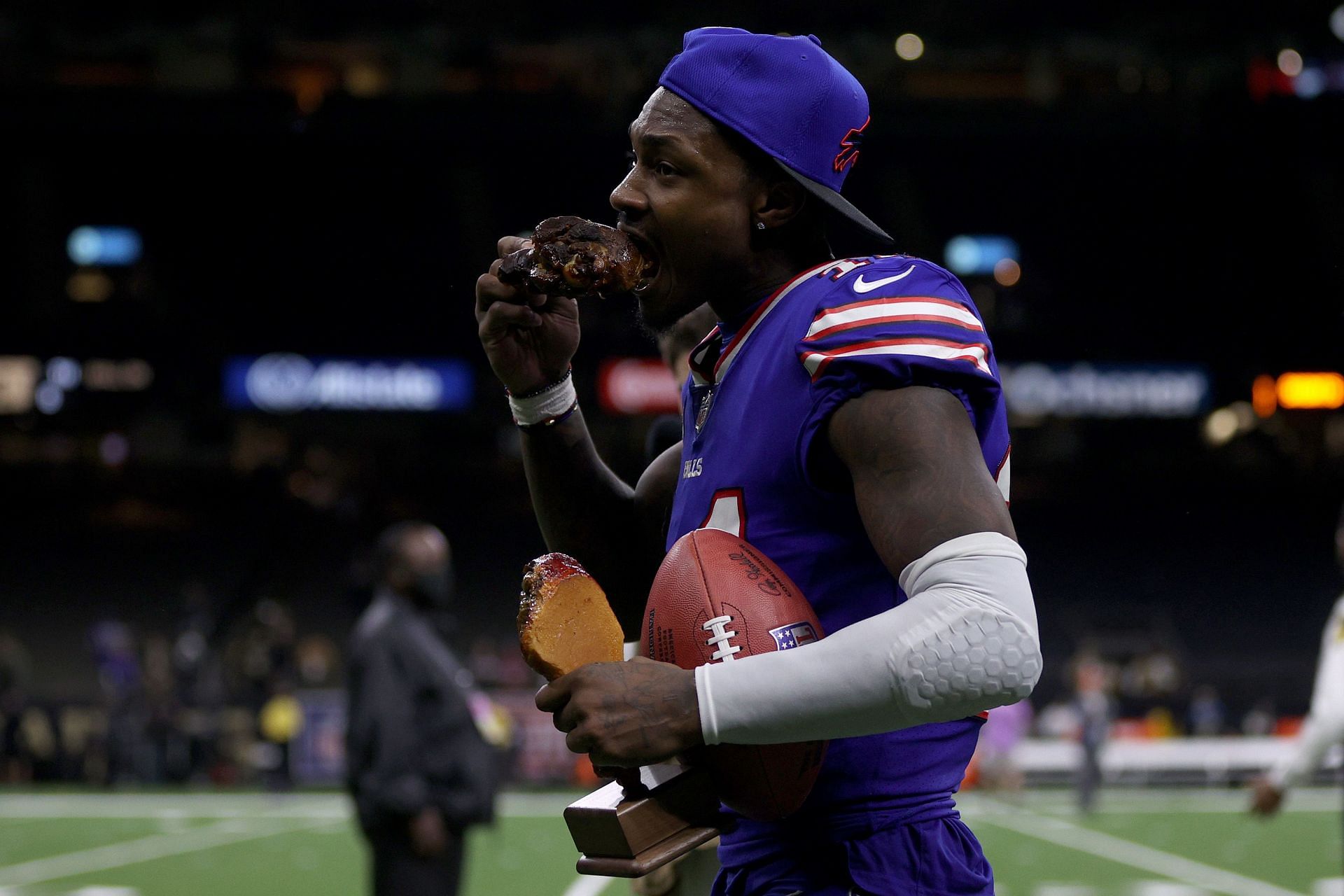 Buffalo Bills wide receiver Stefan Diggs enjoys a turkey leg, the spoils of victory after Thursday&#039;s 31-6 win over New Orleans