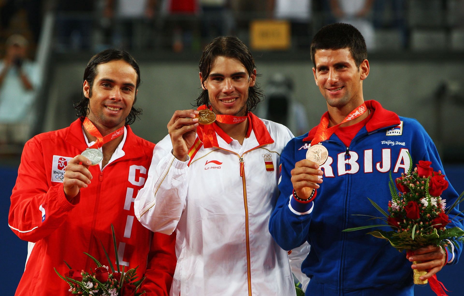 Rafael Nadal, Fernando Gonzalez and Novak Djokovic celebrate with their respective gold, silver and bronze medals at the 2008 Beijing Olympics