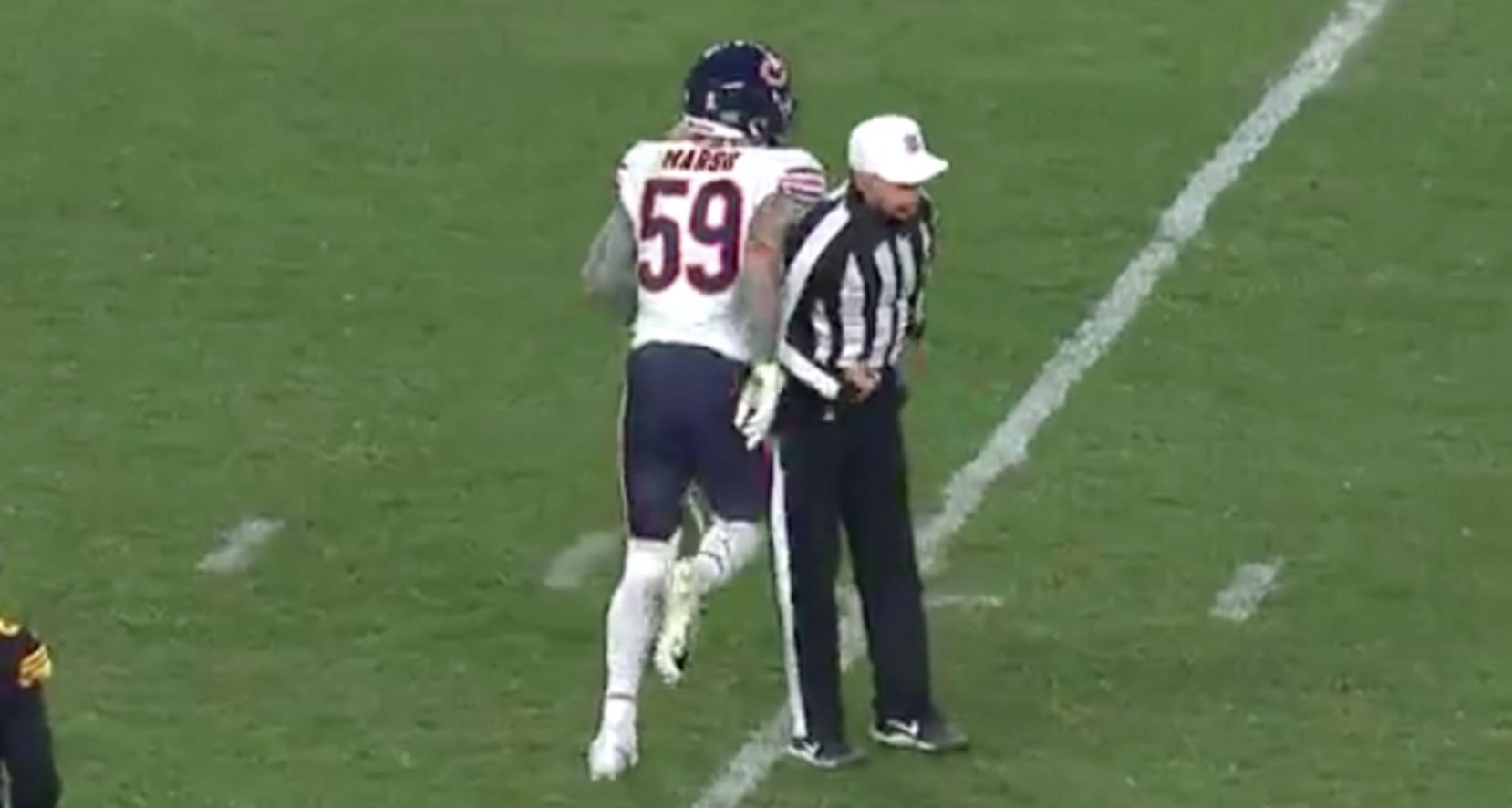 Referee Tony Corrente bumped into Cassius Marsh before throwing a flag on Marsh for taunting