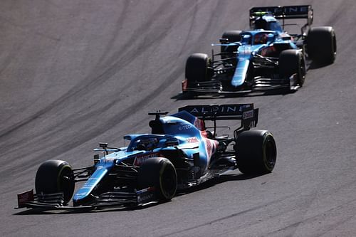 Alpine F1 team driver Fernando Alonso leading Esteban Ocon on track. (Photo by Lars Baron/Getty Images)