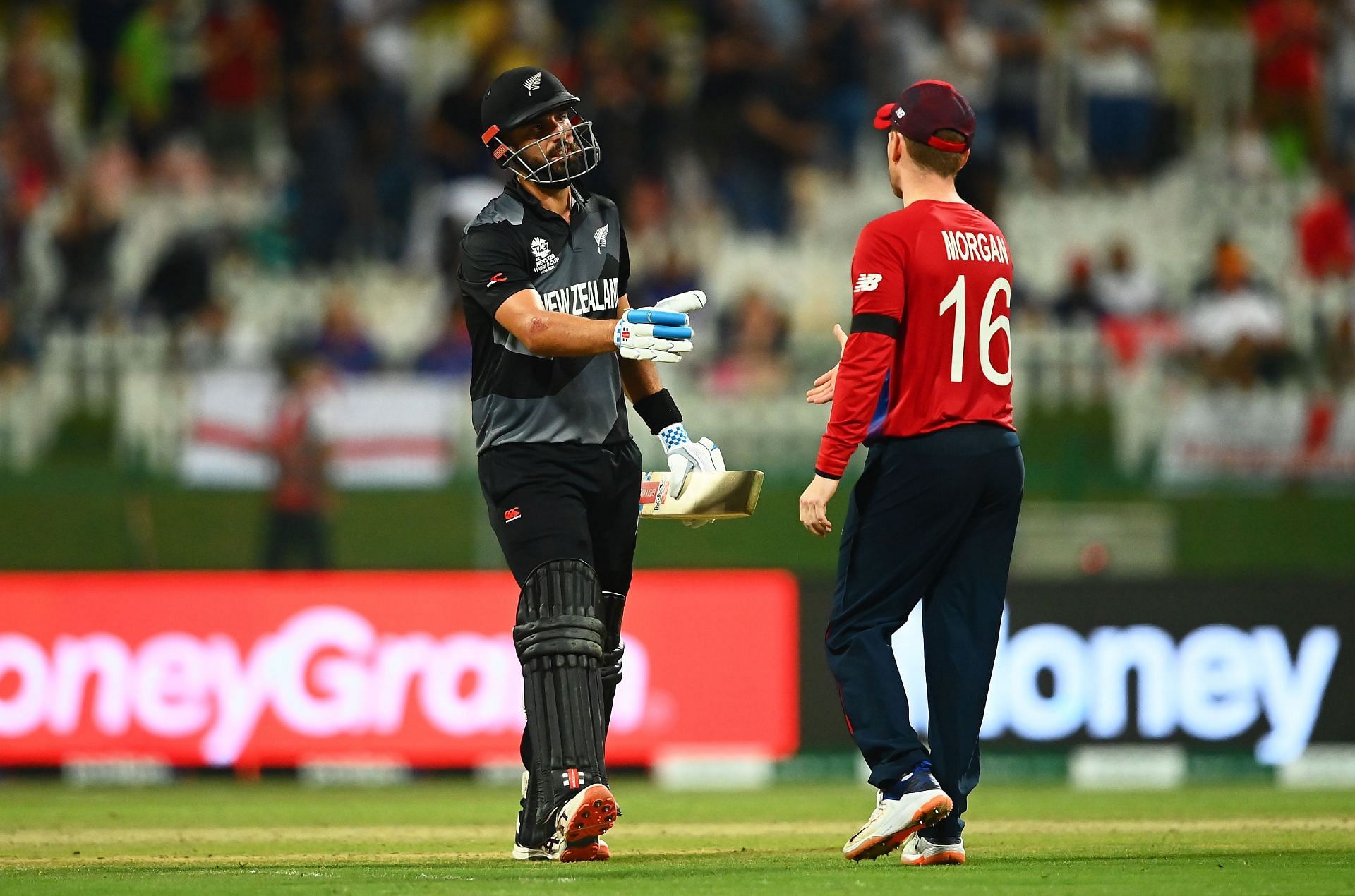 Eoin Morgan (right) congratulates Daryl Mitchell.