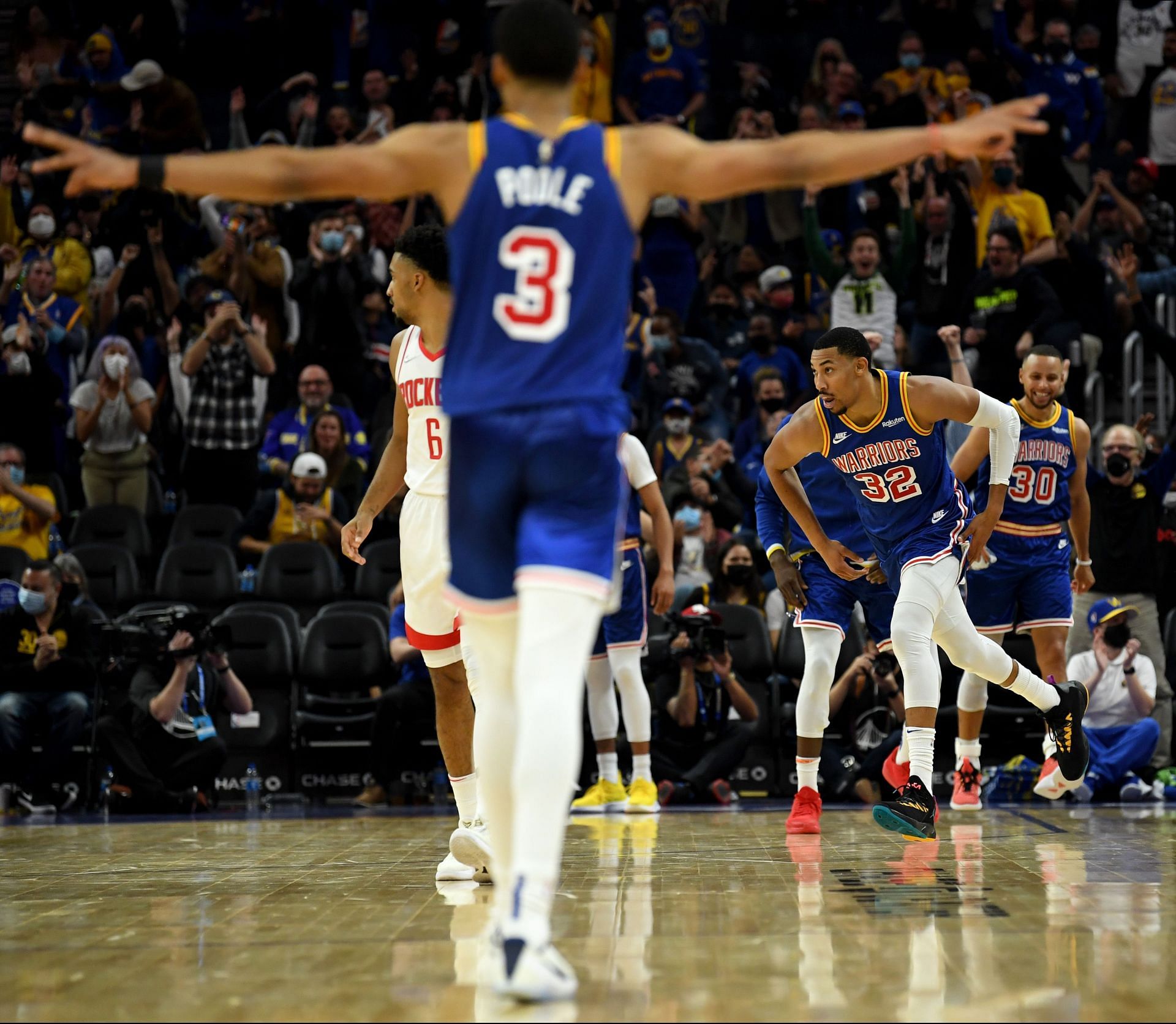 Jordan Poole and Stephen Curry in action for the Golden State Warriors