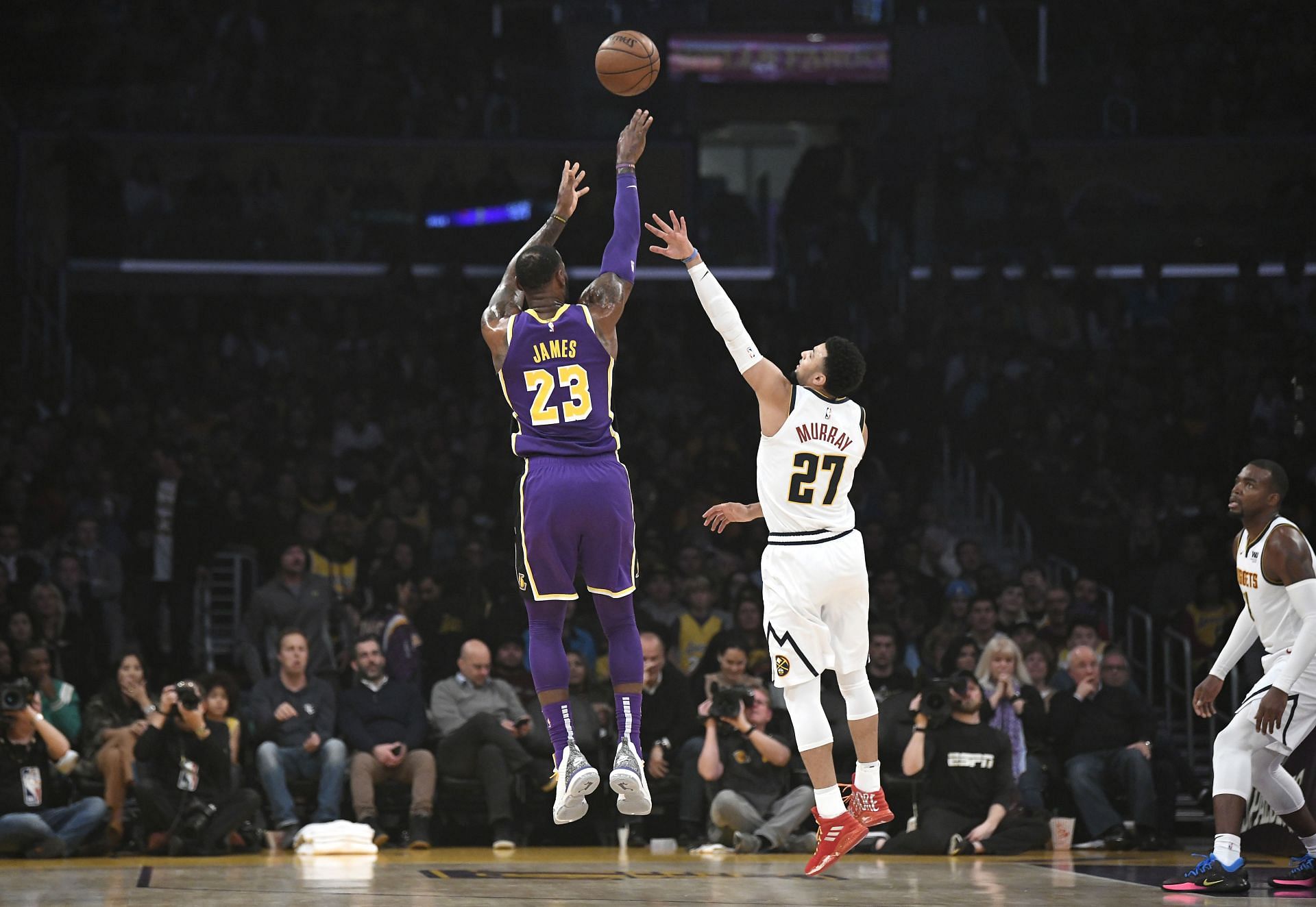 LeBron James of the Los Angeles Lakers shoots over Jamal Murray of the Denver Nuggets.