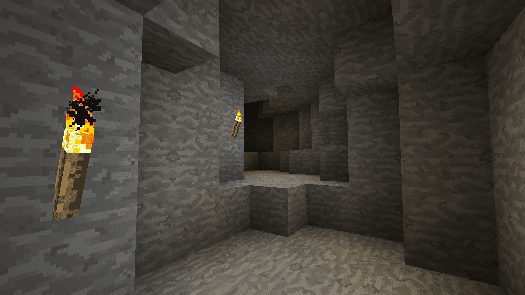 Torches in a cave (Image via Minecraft)