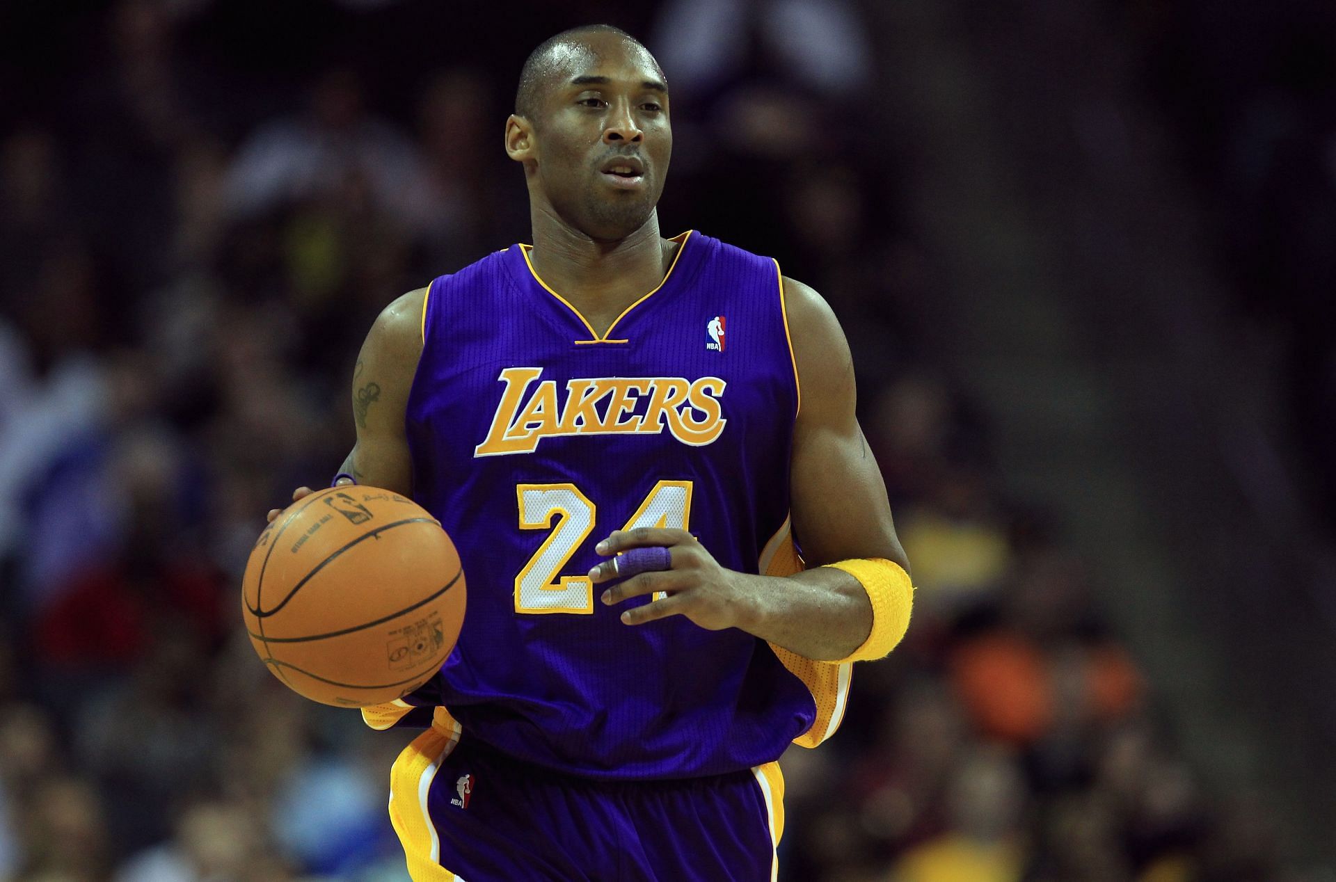 Kobe Bryant #24 of the Los Angeles Lakers dribbles the ball up the court against the Charlotte Bobcats during their game at Time Warner Cable Arena on February 14, 2011 in Charlotte, North Carolina.