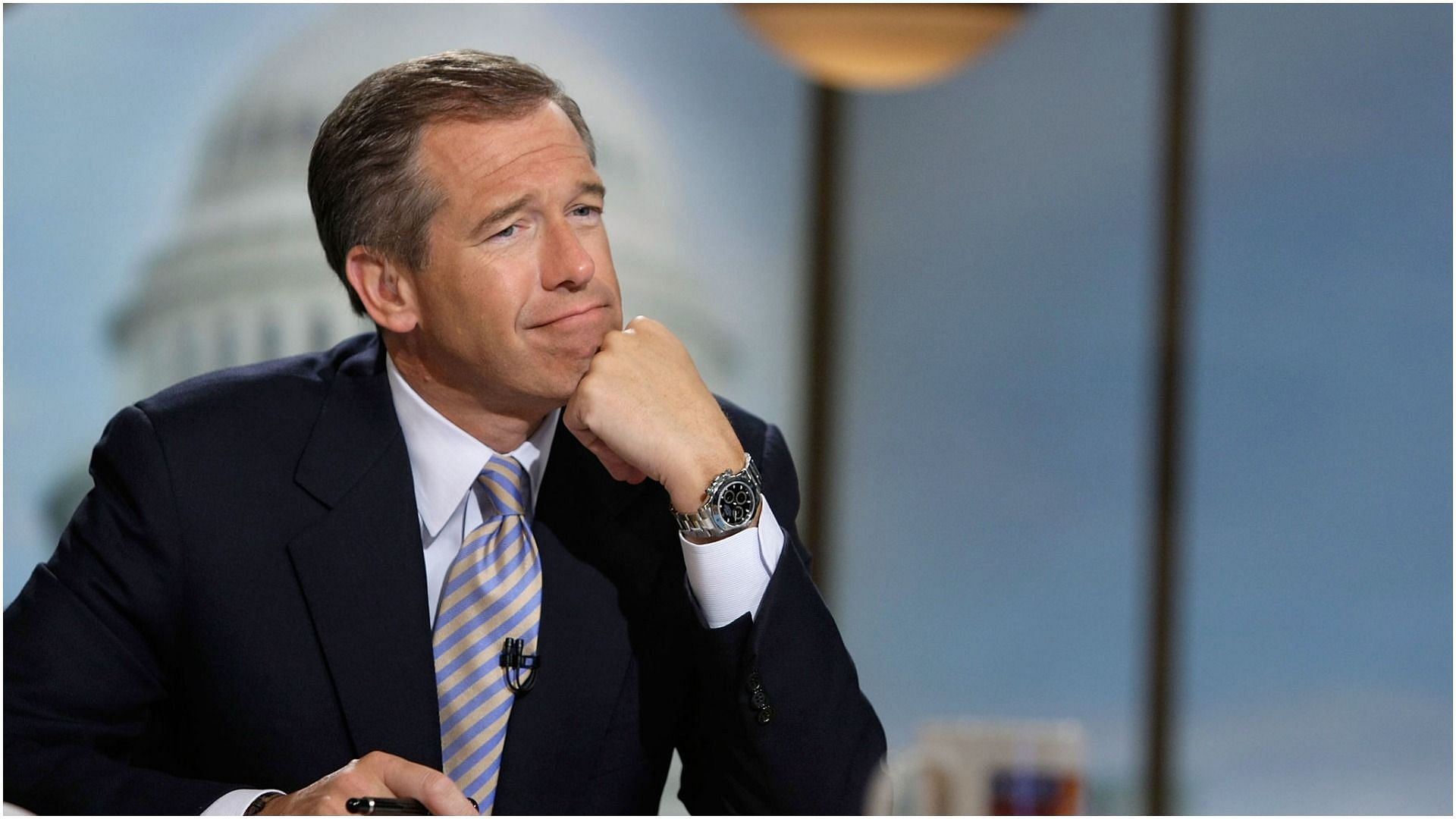 Brian Williams watches a video that pays tribute to late moderator Tim Russert during a taping of &quot;Meet the Press&quot; at the NBC studios June 22, 2008, in Washington, DC (Image via Getty Images)