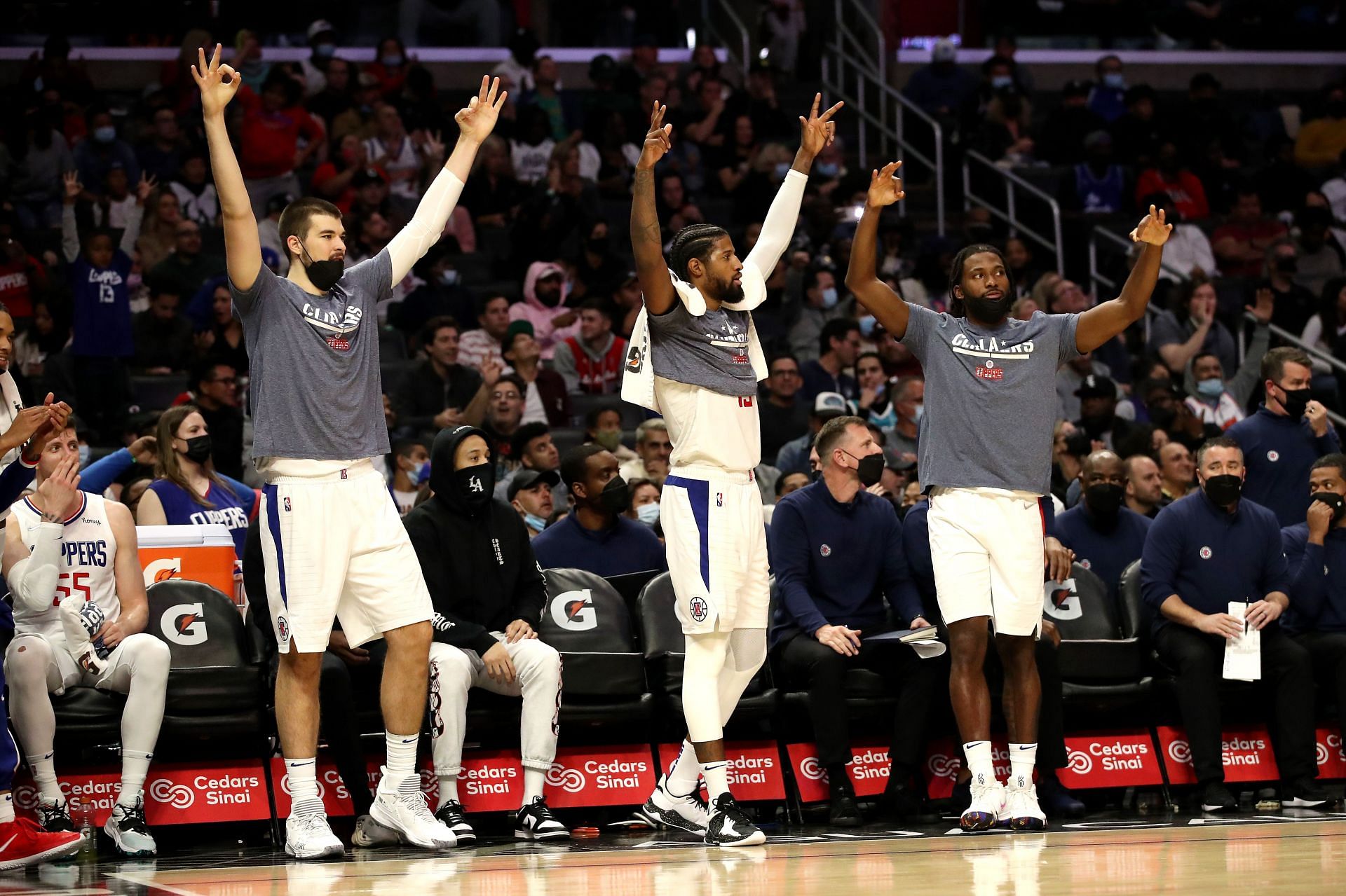 Ivica Zubac #40, Paul George #13 and Justise Winslow #20 of the Los Angeles Clippers