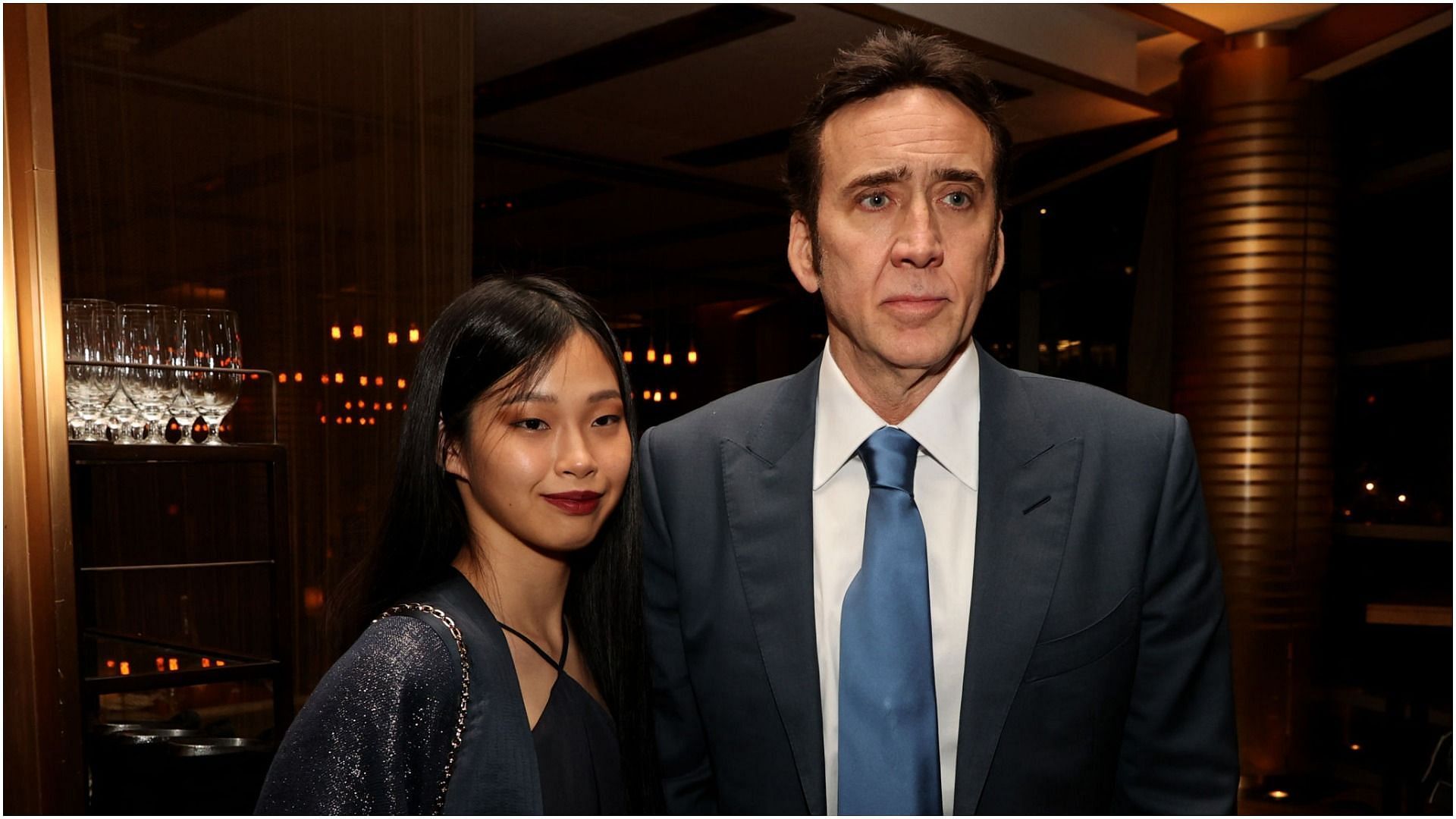 Nicolas Cage and Riko Shibata pose at the after-party for the premiere of Neon&#039;s &quot;Pig&quot; at Craft Restaurant (Image by Kevin Winter via Getty Images)