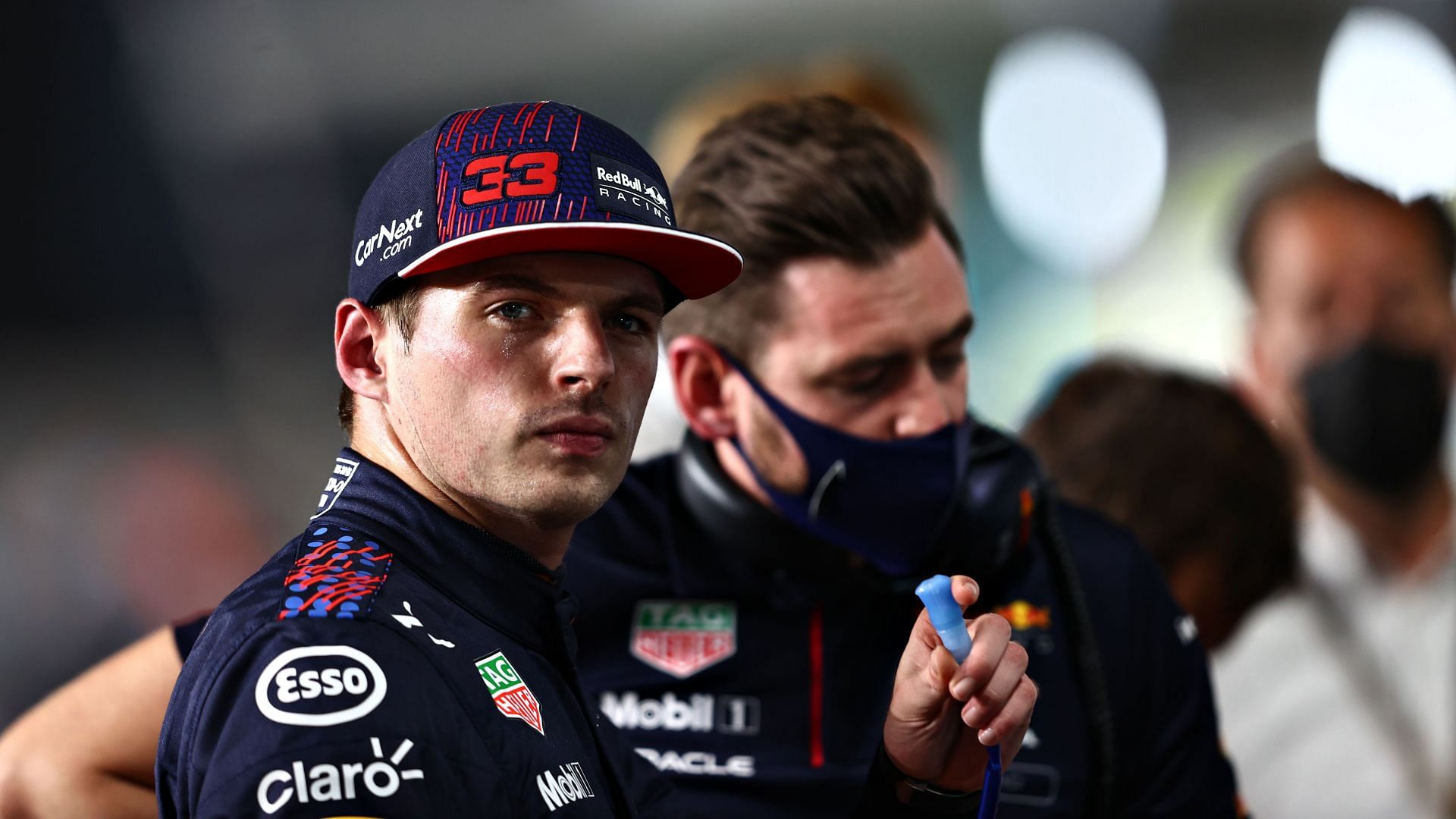 Second place qualifier Max Verstappen looks on in parc ferme.