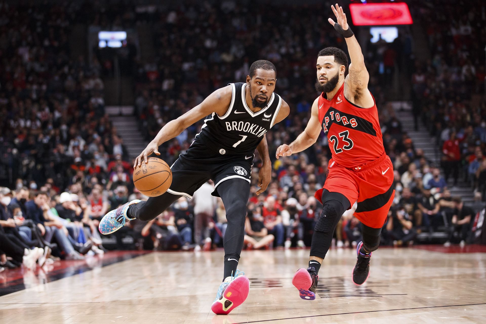 Kevin Durant #7 of the Brooklyn Nets drives on Fred VanVleet #23 of the Toronto Raptors during the first half of their NBA game at Scotiabank Arena on November 7, 2021 in Toronto, Canada. Brooklyn Nets v Chicago Bulls Brooklyn Nets v Detroit Pistons Enter caption