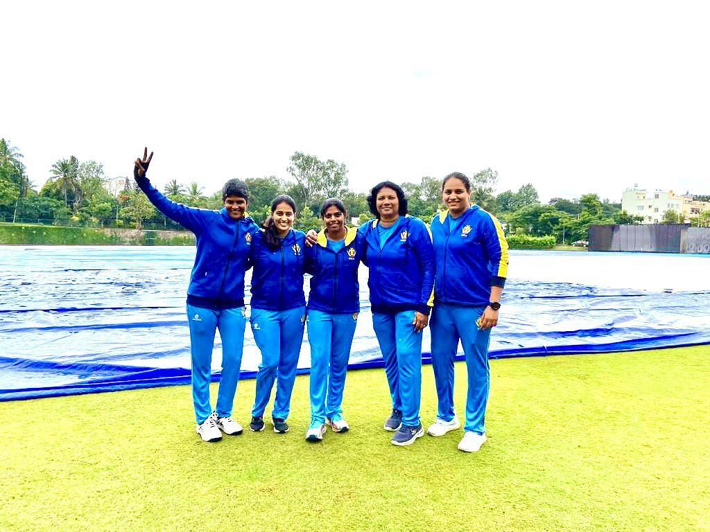 Mamatha Maben (L) poses alongside the Karnataka support staff members