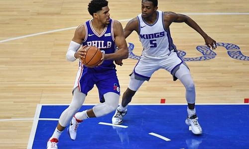 De'Aaron Fox of the Sacramento Kings guarding Philadelphia 76ers' Tobias Harris