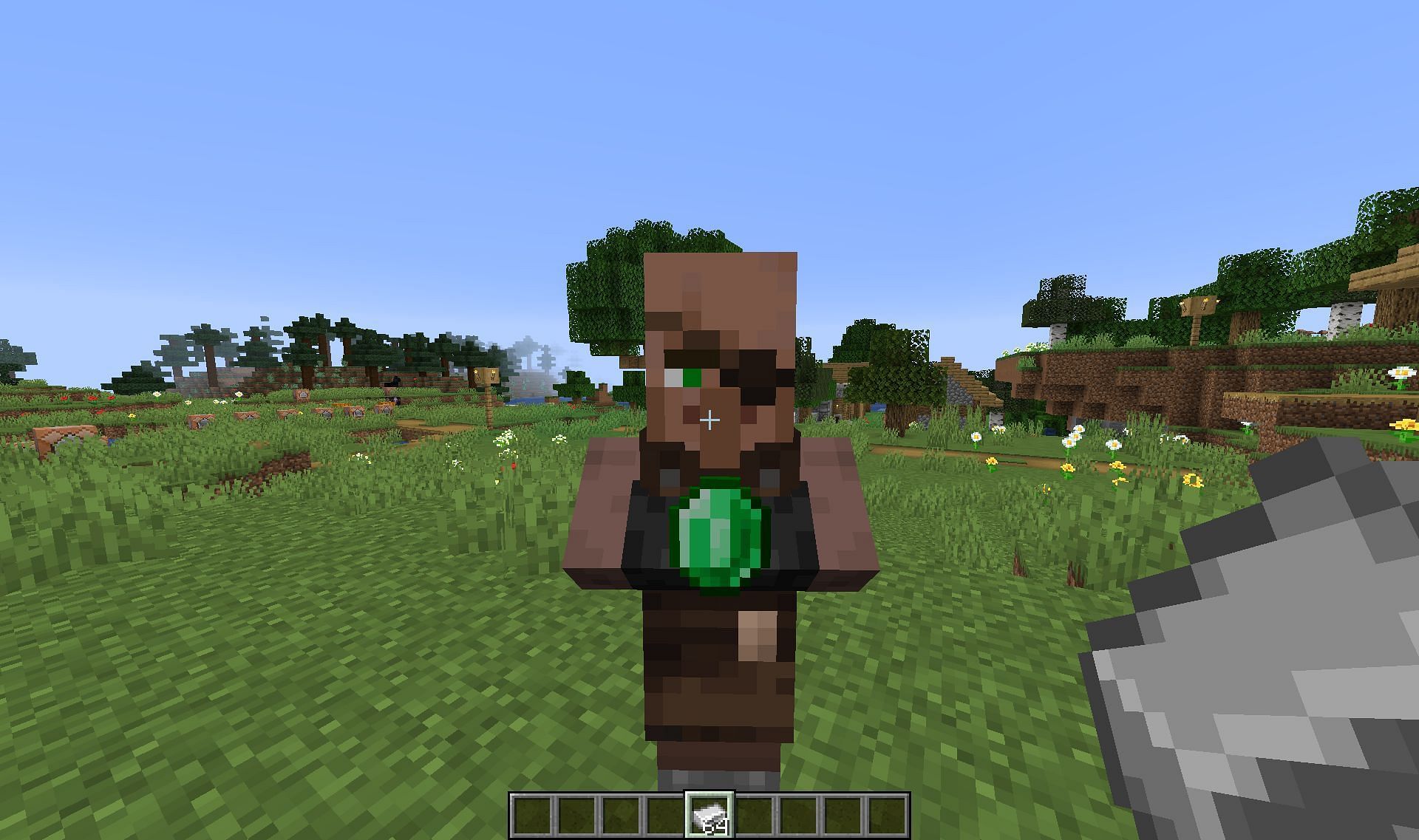 A weaponsmith villager holding an emerald (Image via Reddit)