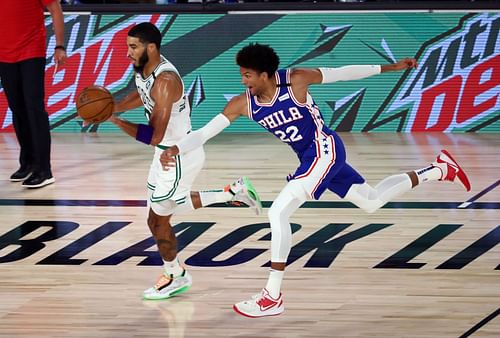 Matisse Thybulle of the Philadelphia 76ers tries to steal the ball from Boston Celtics' Jayson Tatum