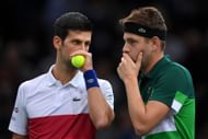 Novak Djokovic playing doubles with Filip Krajinovic at the Rolex Paris Masters