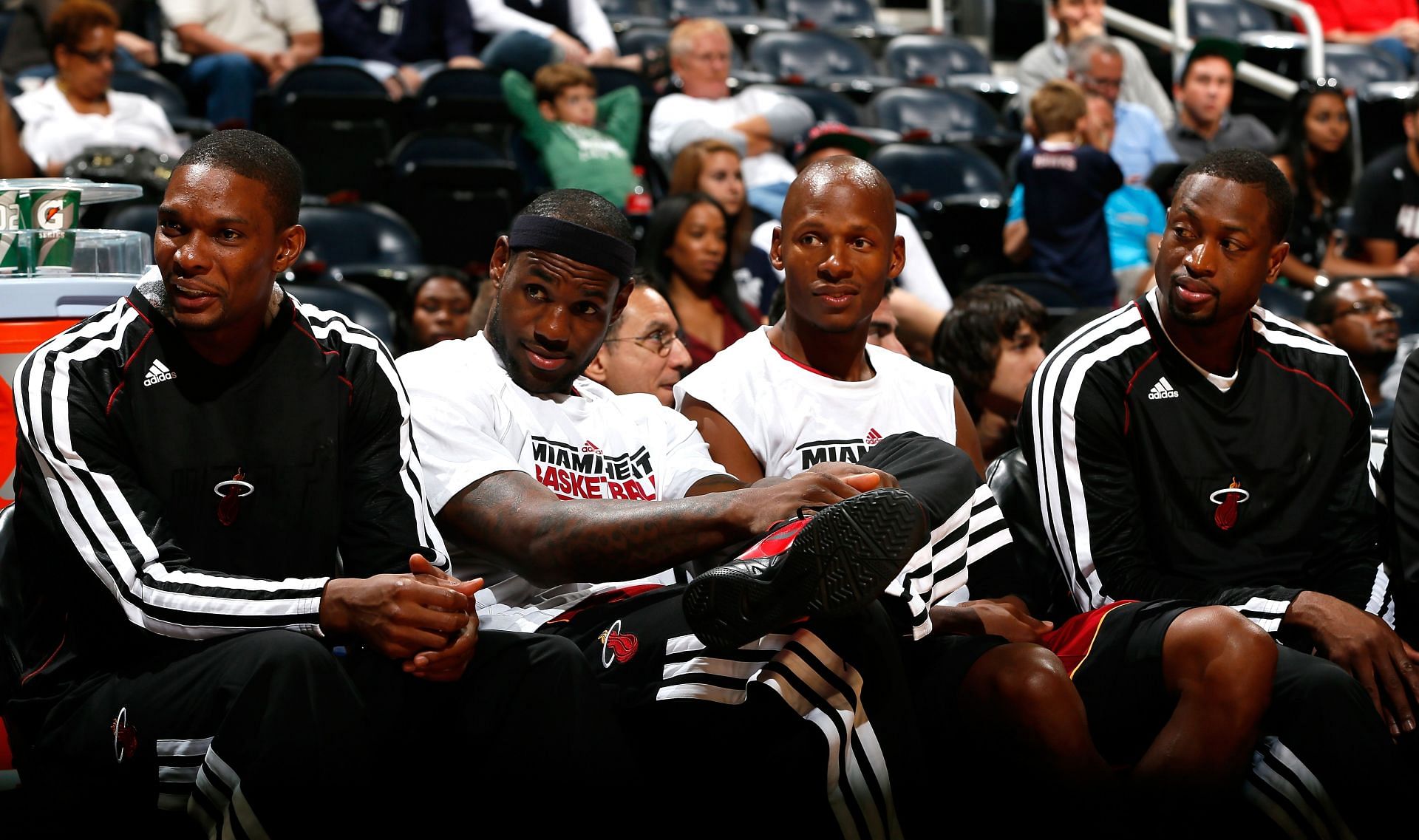 Chris Bosh, from left; LeBron James, Ray Allen and Dwyane Wade #3 of the Miami Heat watch the game against the Atlanta Hawks at Philips Arena on October 7, 2012, in Atlanta.