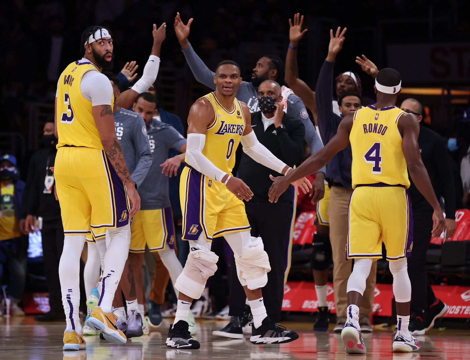 Anthony Davis (L), Russell Westbrook (C) and Rajon Rondo (#4) of the Los Angeles Lakers