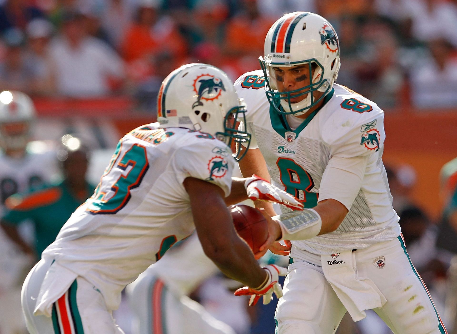 Matt Moore (8) hands the ball off to Steve Slaton during the drive in question (Photo: Getty)