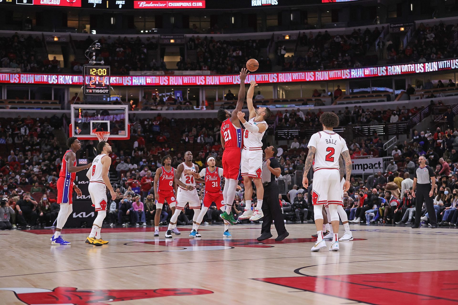 Joel Embiid (#21) of the Philadelphia 76ers goes up against Nikola Vucevic of the Chicago Bulls