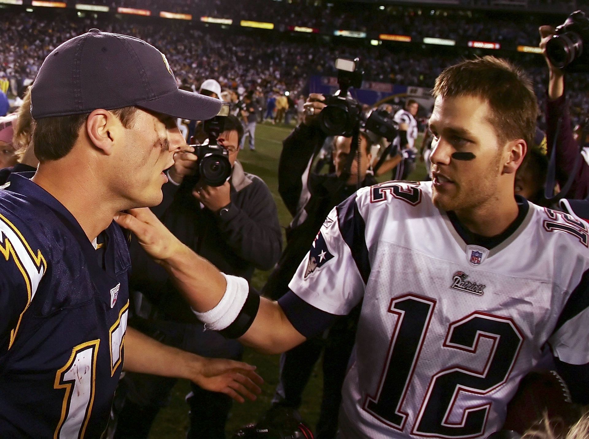 Brady (12) and Phillip Rivers, one of his most common victims 