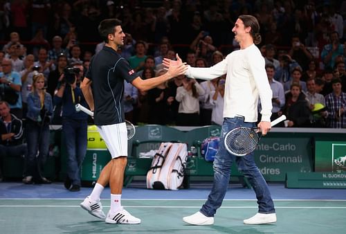 Novak Djokovic shakes hands with Zlatan Ibrahimovic at the 2013 Paris Masters