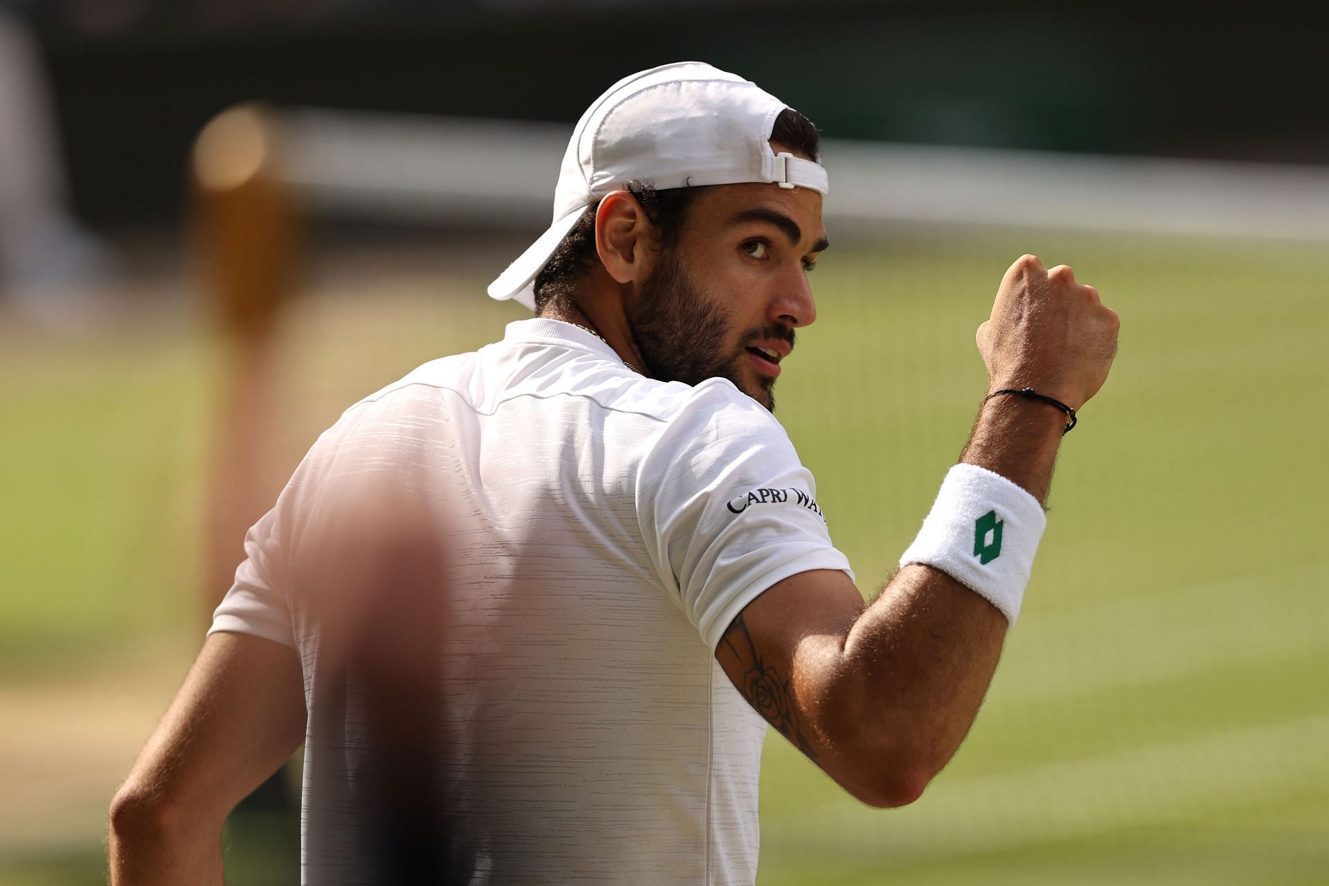 Berrettini celebrates a point against Djokovic at the Wimbledon final