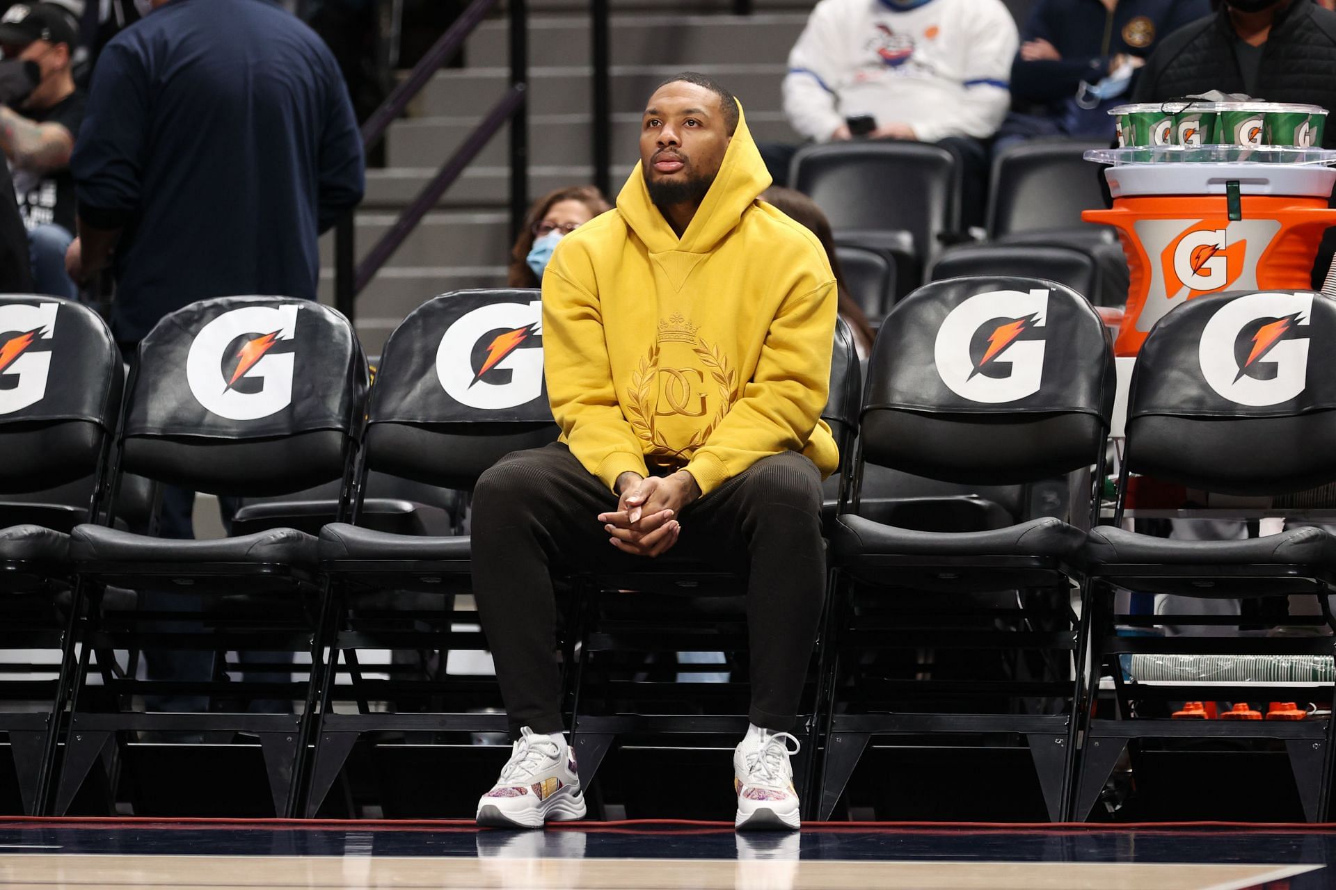 Damian Lillard #0 of the Portland Trail Blazers sits on the bench before the game against the Denver Nuggets at Ball Arena on November 14, 2021, in Denver, Colorado.