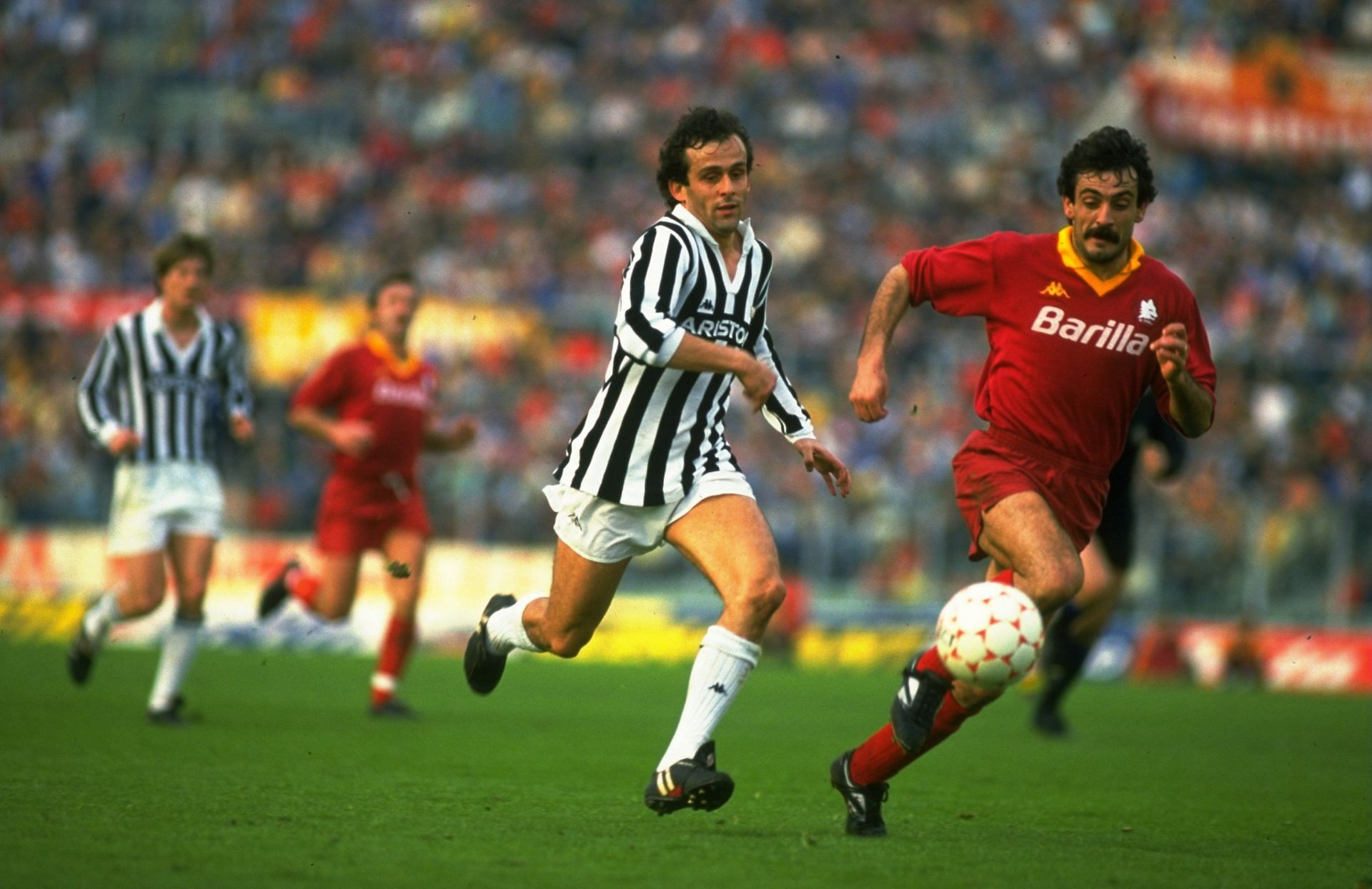 Michel Platini of Juventus and Emidio Oddi of Roma
