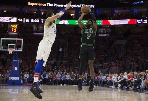 Jaylen Brown #7 of the Boston Celtics shoots the ball against Ben Simmons #25 of the Philadelphia 76ers