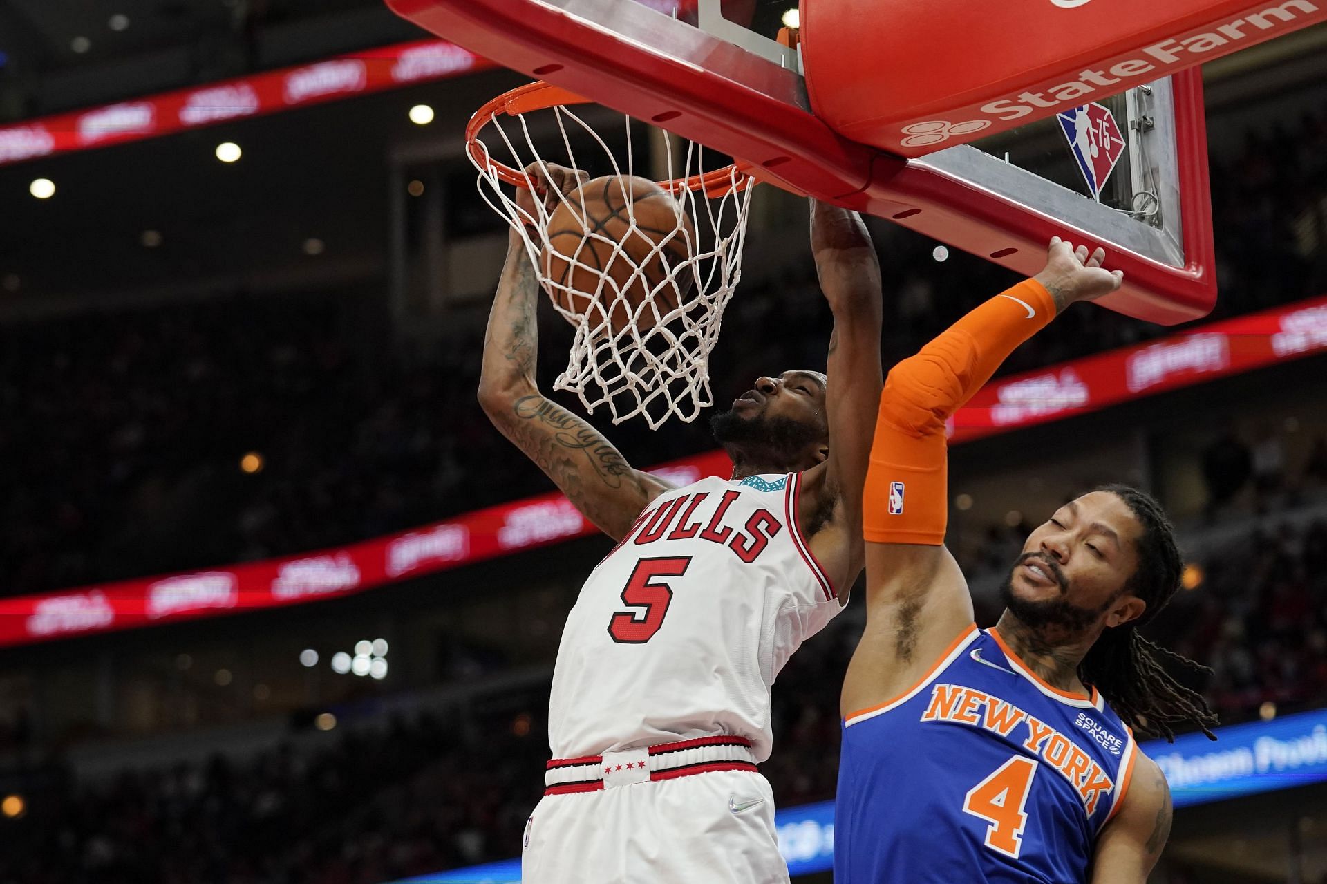 Derrick Rose of the New York Knicks (R) against the Chicago Bulls