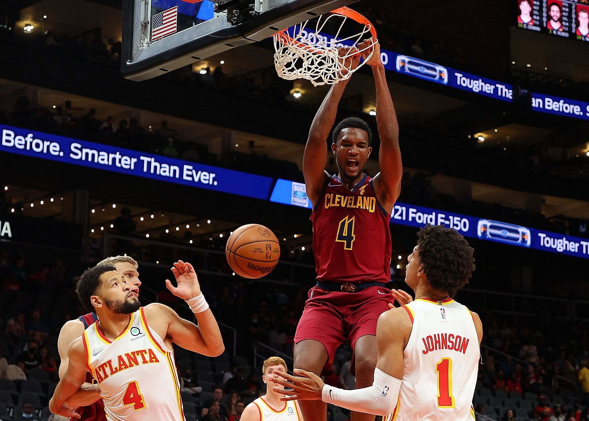 Cleveland Cavaliers starting power forward Evan Mobley #4 dunking on defenders