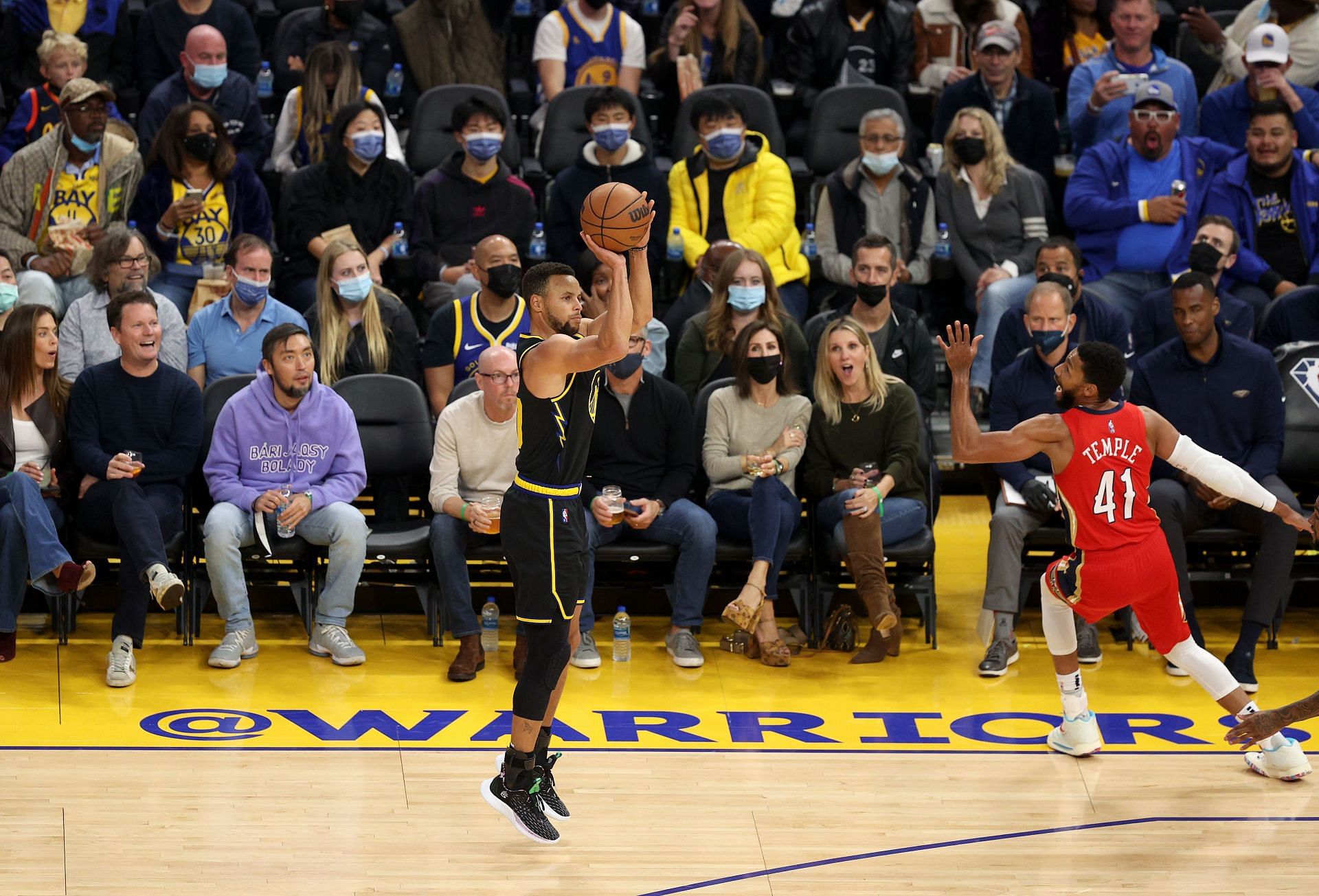 Stephen Curry #30 of the Golden State Warriors shoots a three -point basket over Garrett Temple #41 of the New Orleans Pelicans at Chase Center on November 05, 2021 in San Francisco, California.