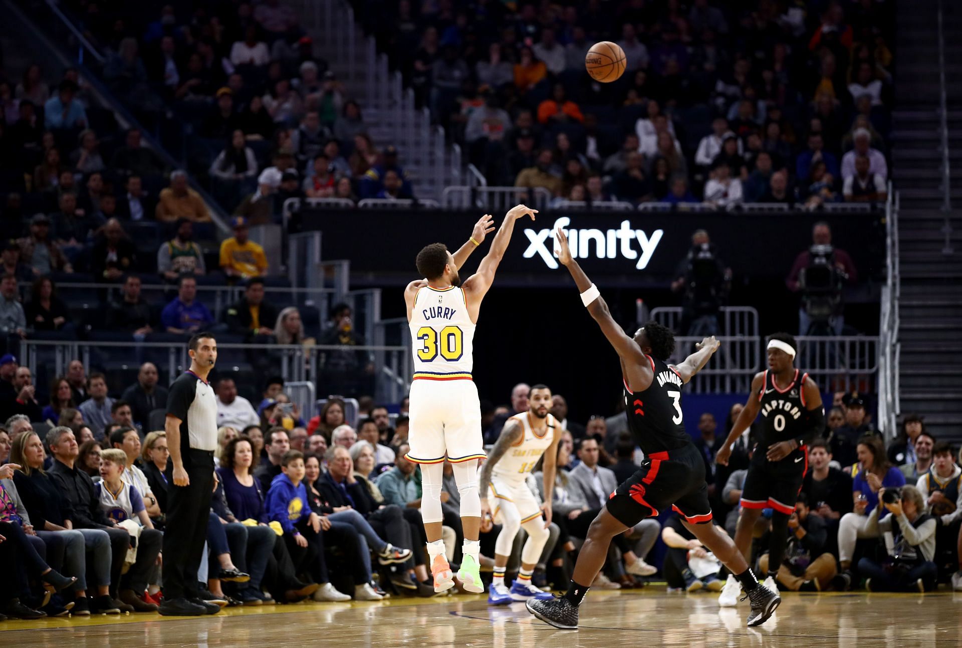 Steph Curry of the Golden State Warriors takes a three-point shot against the Toronto Raptors.