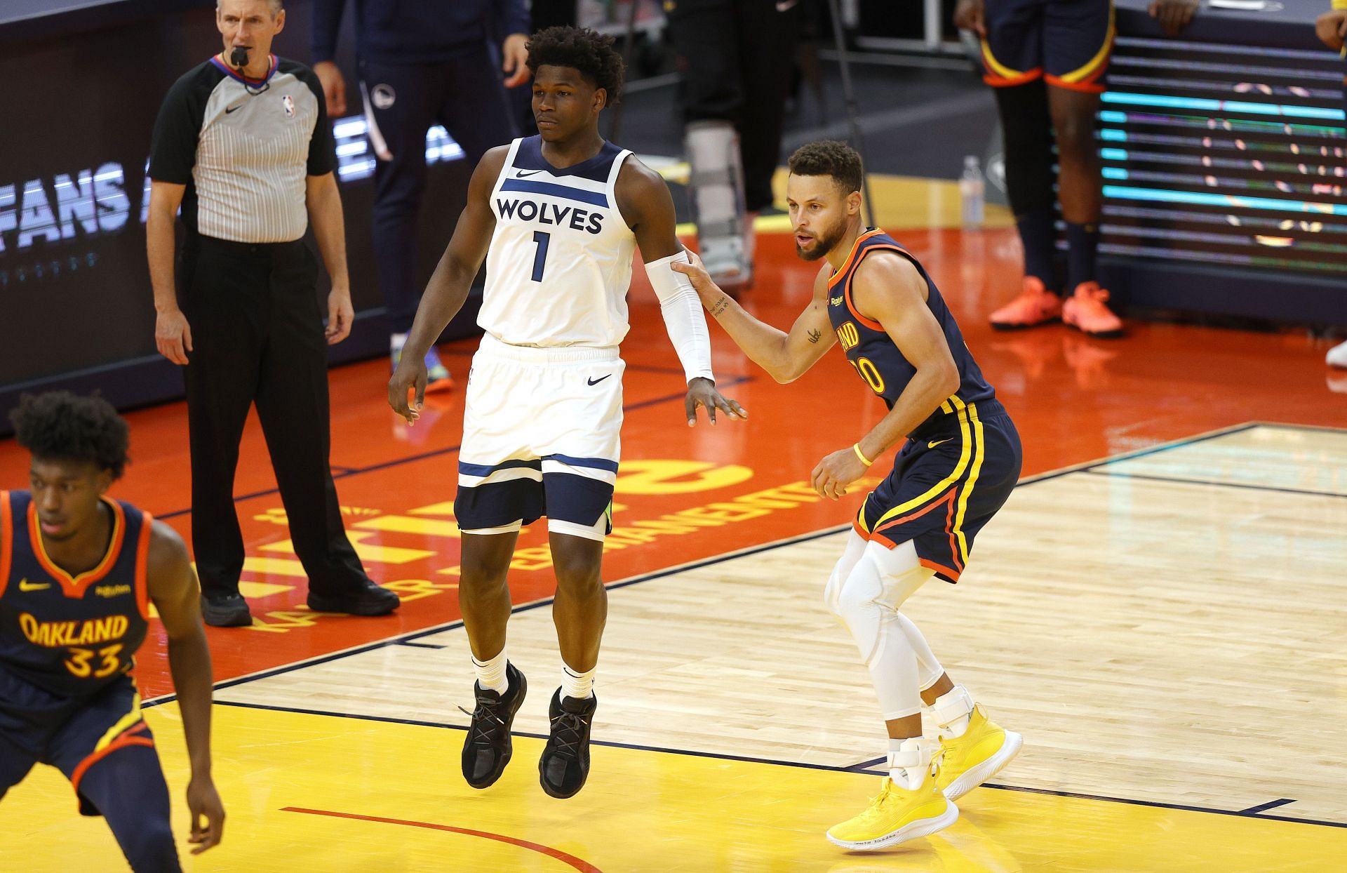 Anthony Edwards of the Minnesota Timberwolves alongside Stephen Curry of the Golden State Warriors