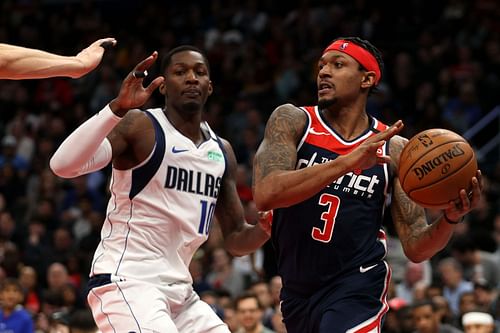 Dorian Finney-Smith of the Dallas Mavericks defends Bradley Beal of the Washington Wizards.